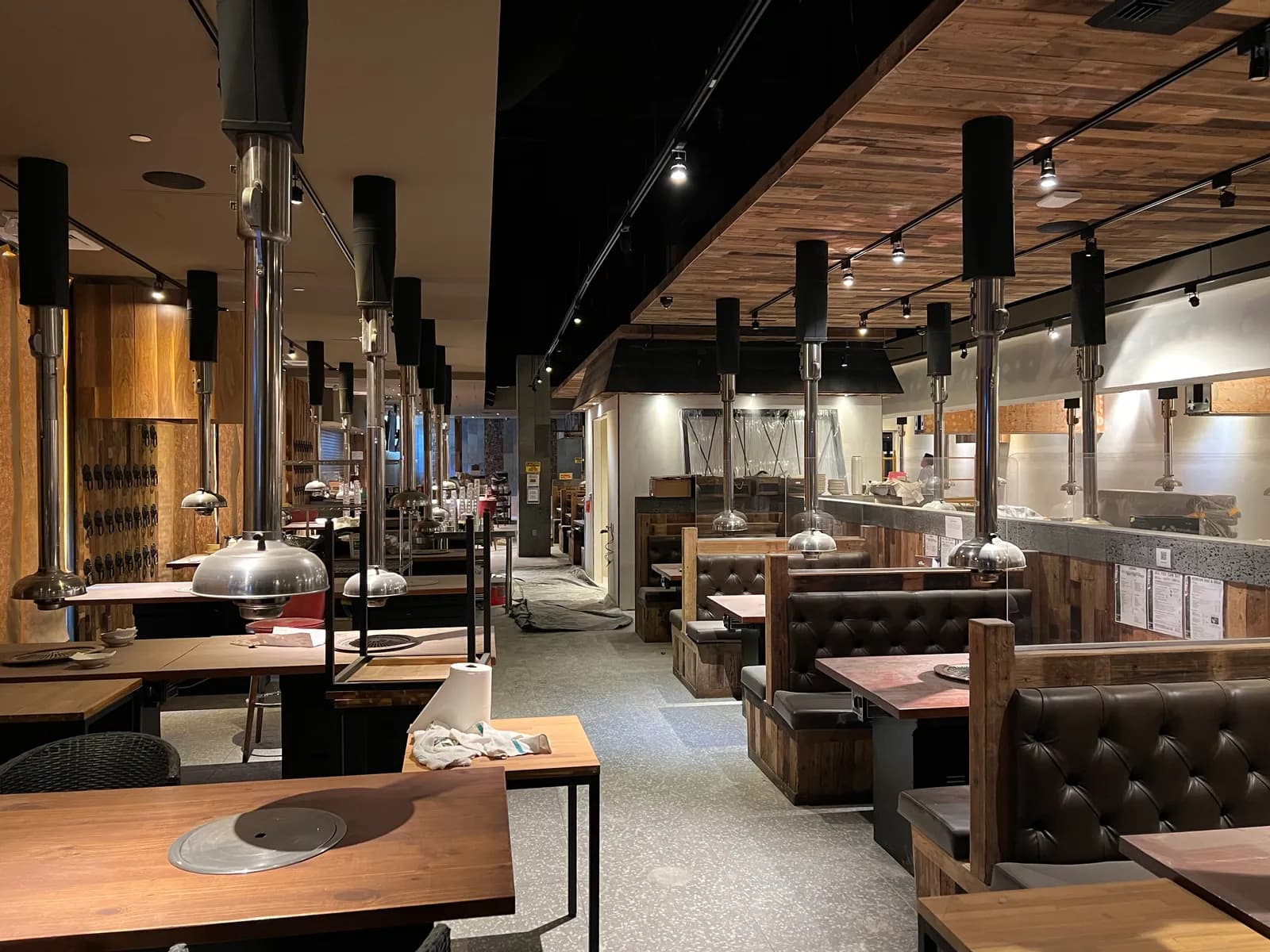 Completed Korean BBQ restaurant dining room in Las Vegas with grill tables and exhaust hoods